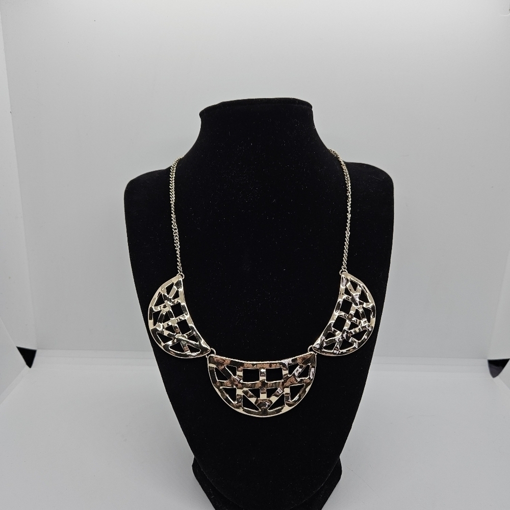 gold tone articulated crescent bib necklace